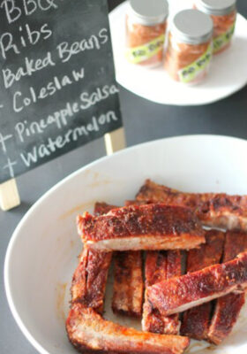 plate of ribs, cooked and cripsy on a table with spice rub, decorative