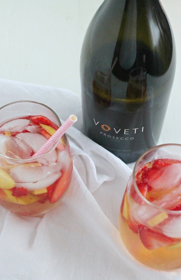 Peach and Strawberry Sparkling Sangria - the perfect cocktail for your spring, and summer soirees! | casadecrews.com