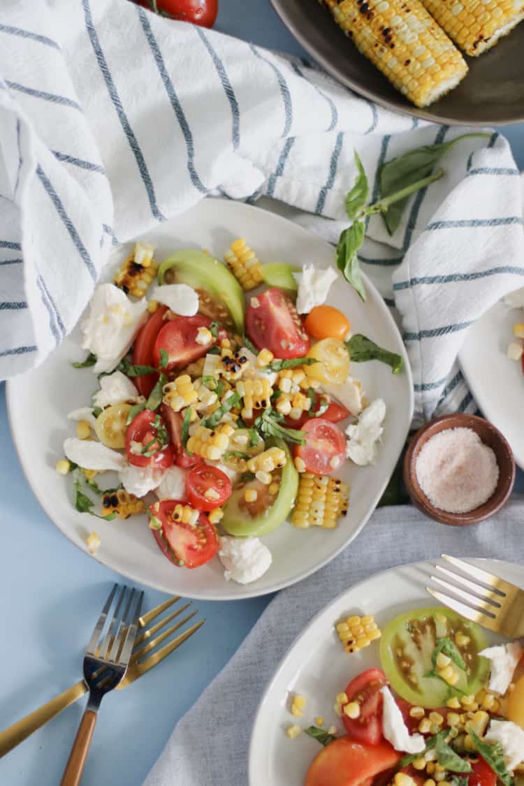 Charred Corn Caprese Salad. Grilled corn adds a depth of smoky sweet flavor to the classic Caprese Salad for summer!