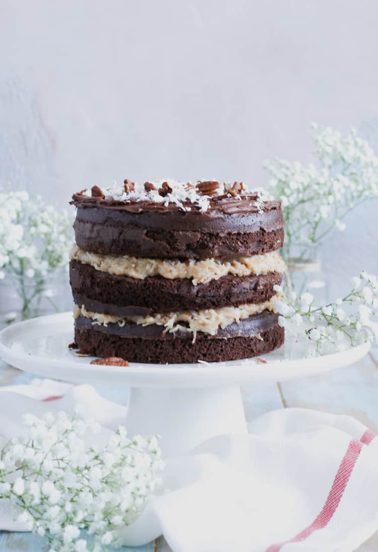 Boxed Chocolate Cake Mix, layered with homemade sweet coconut and pecan filling, give this classic cake a more modern look!