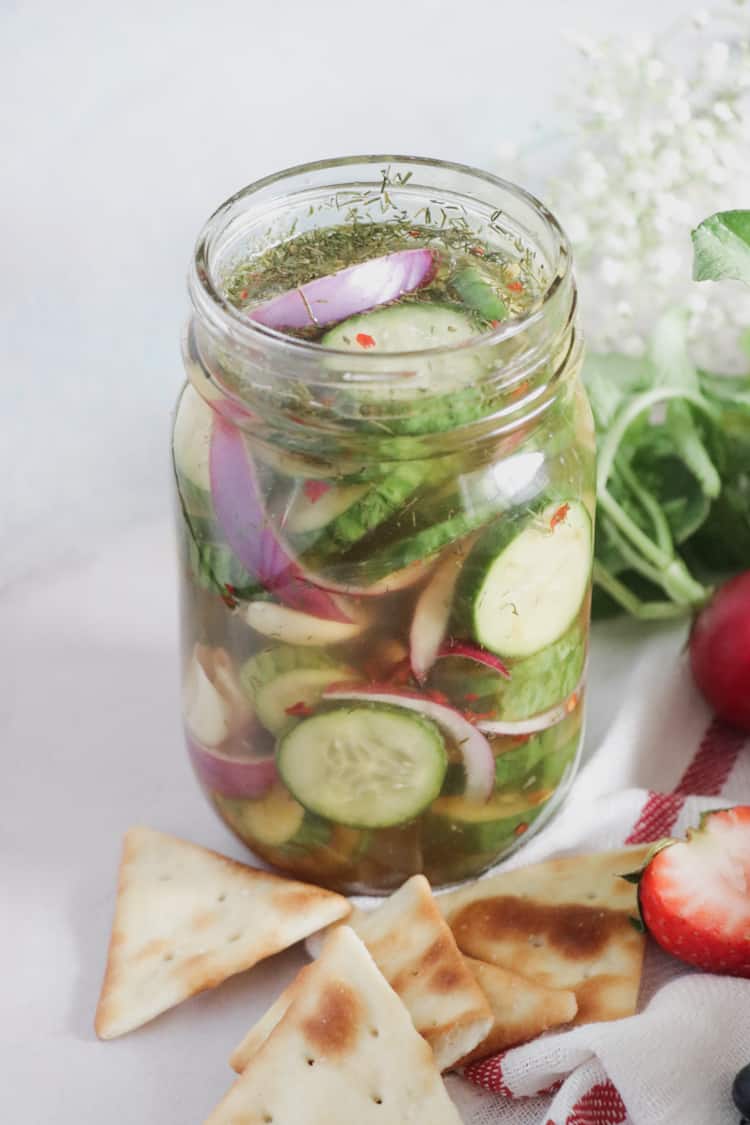 Easy homemade dill pickles. This pickle recipe is full of flavor thanks to fresh dill and garlic, with red onion. No canning is required to get crunchy, and delicious refrigerator pickles!