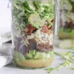 shredded brussels sprouts salad with bacon and dried figs