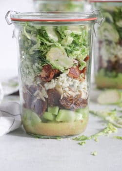 shredded brussels sprouts salad with bacon and dried figs