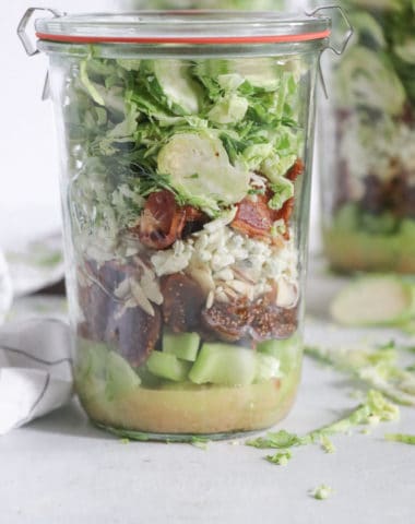 shredded brussels sprouts salad with bacon and dried figs