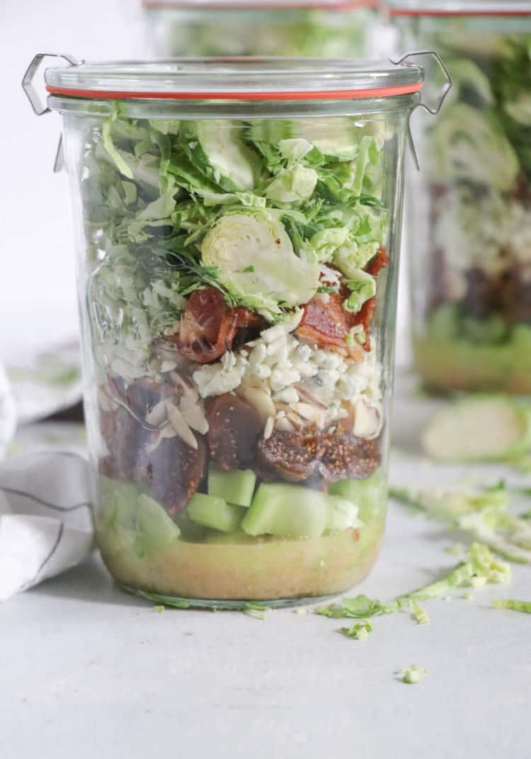 shredded brussels sprouts salad with bacon and dried figs