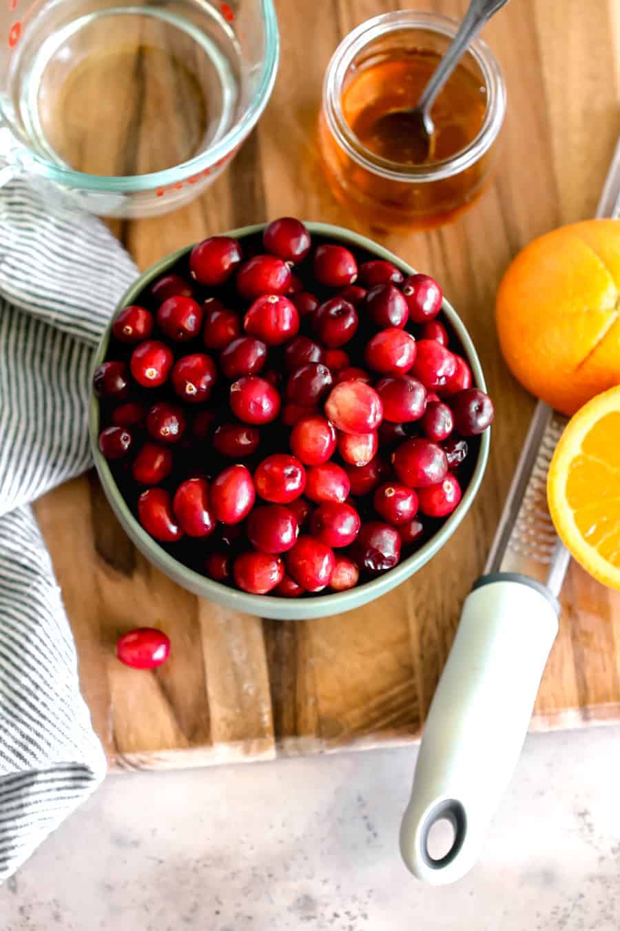 cranberry sauce ingredients: 1 bag of cranberries, honey, navel orange with lemon zester, water