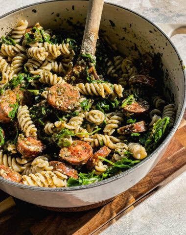 fusilli pasta with store bought pesto with arugula and chicken sausage in a white pot